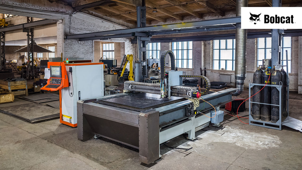 CNC laser cutting machine for sheet metal in the production area. The picture was taken in Russia, in the workshop of a mechanical plant